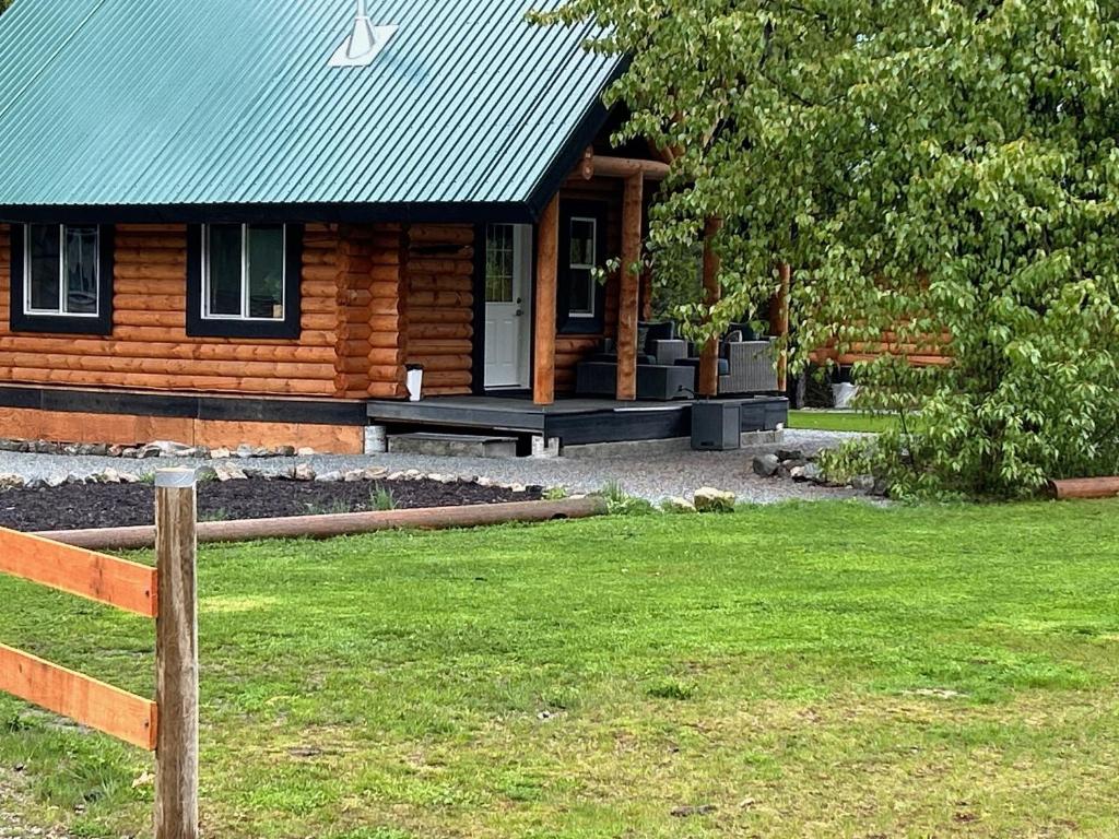 Log lofted rustic cabin in woods, Kelowna