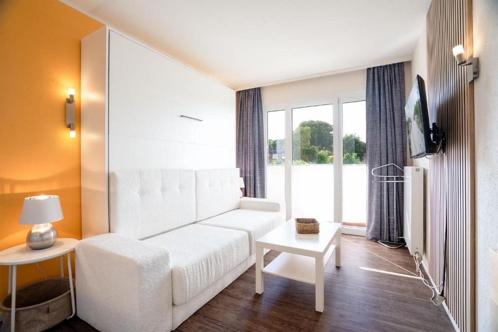 Das Solaris 18 Beach Apartment mit Gemeinschaftssauna und Grillplatz, Grömitz