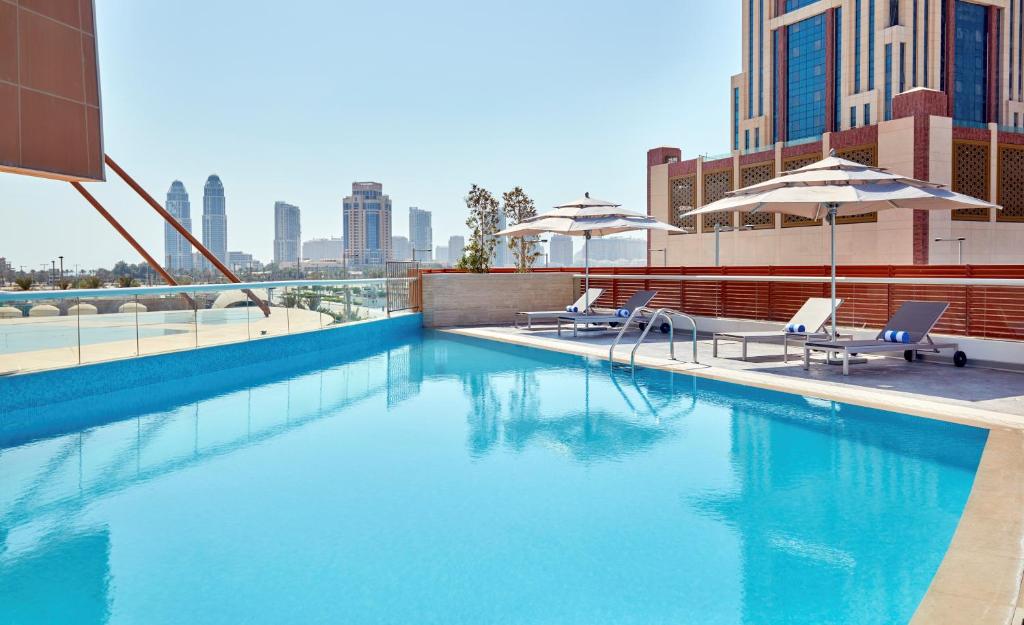 Swimming pool, Staybridge Suites Doha Lusail By IHG in Doha