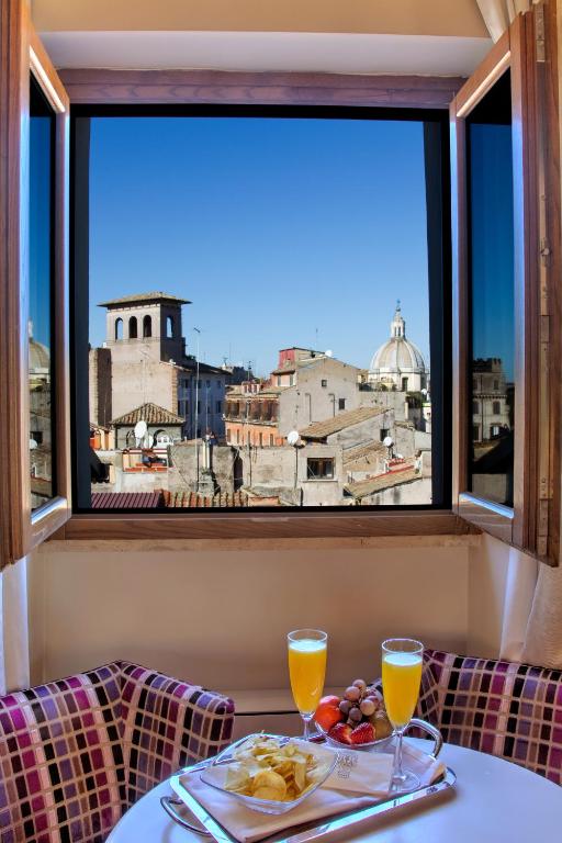 A luxurious hotel room in Rome with comfortable bedding