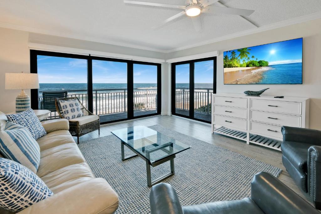 Updated direct oceanfront condo with a balcony, beachfront heated pool and beach access, New Smyrna Beach