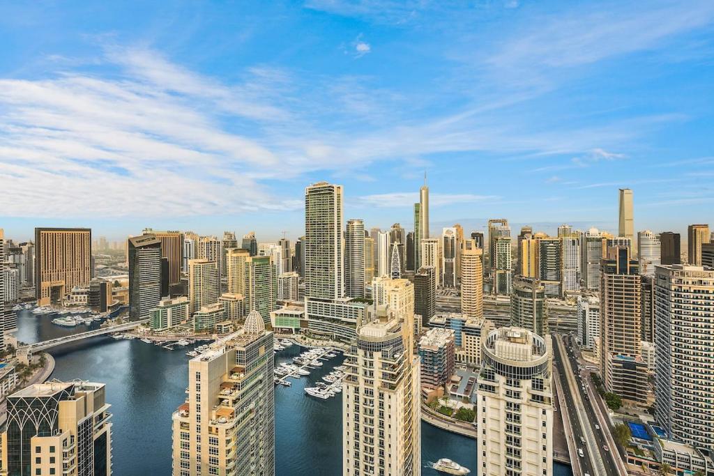 Luxury 4BR Penthouse with Marina Views Steps to JBR Beach & Dining, Дубай