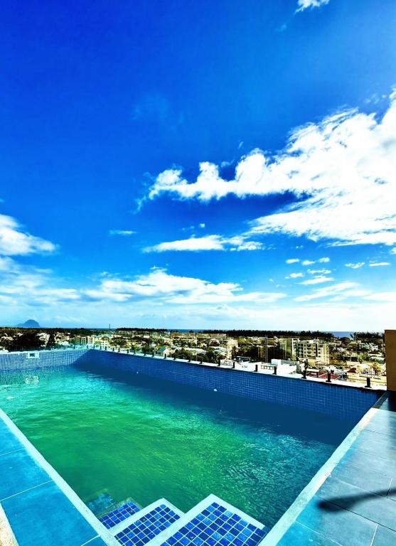 Tropical Escape with Ocean Breeze & Mountain Views, Flic-en-Flac