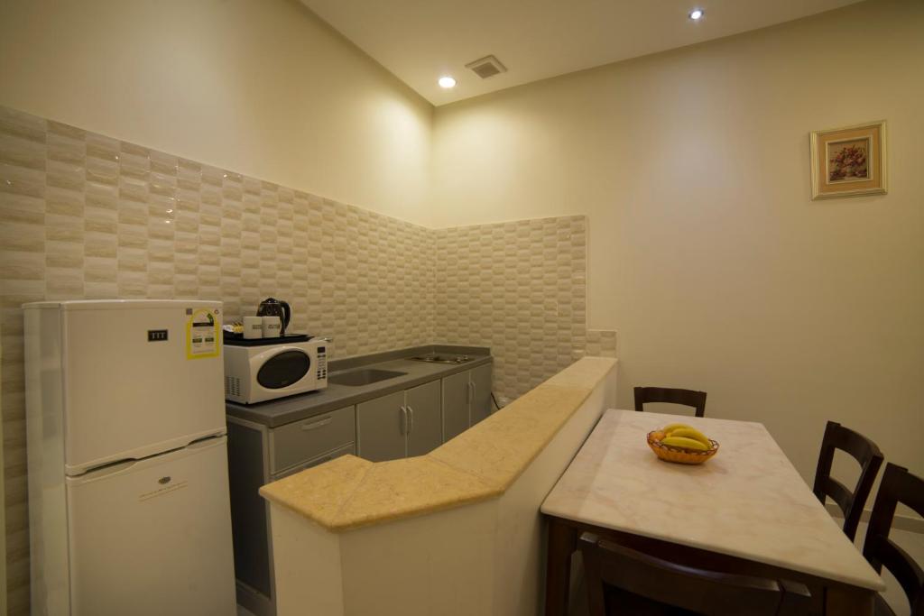 Kyan Al Yarmouk Suites photo