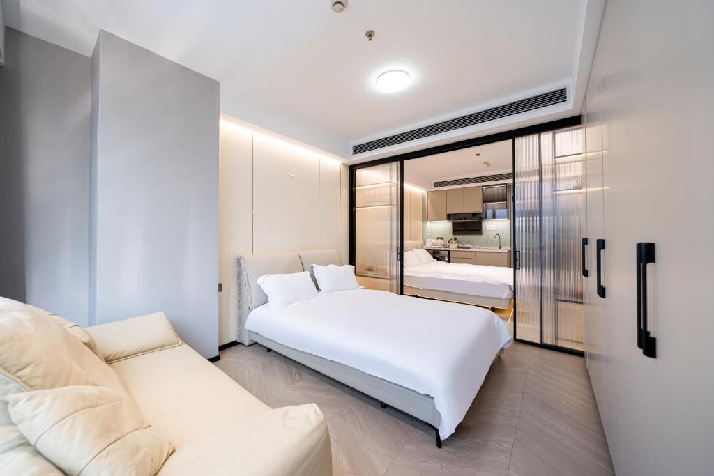 Image showcasing Weekend Aparthotel West Lujiazui Shanghai from $54