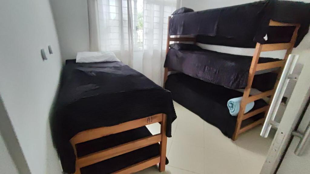 Cama Quarto Black hostel Pousada Tijucas Lua Encantada, Tijucas