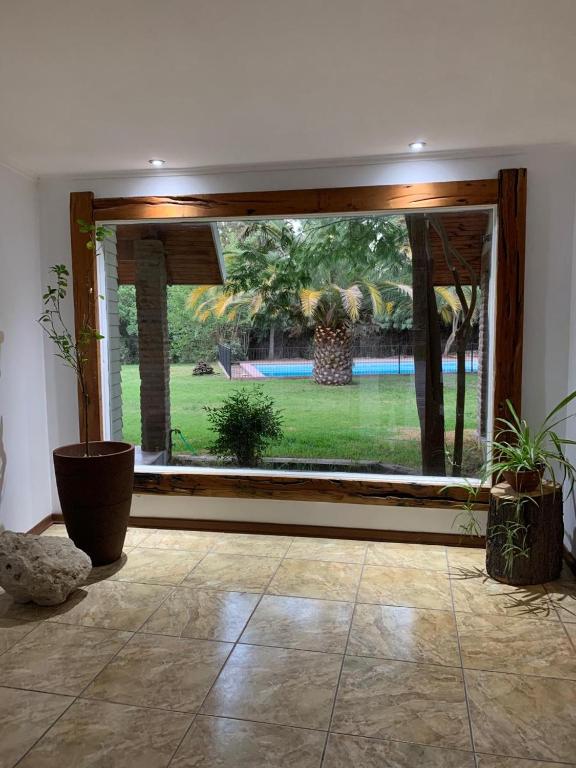 Parcela con Casa, Terraza, Piscina y Quincho en Pirque - 1