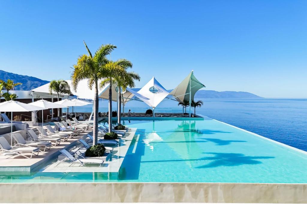 Sunset Getaway with Oceanfront Terrace and Resort Perks - 4