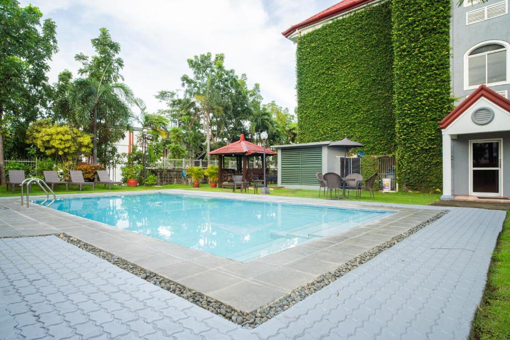 Swimming pool, Microtel by Wyndham Batangas in Batangas