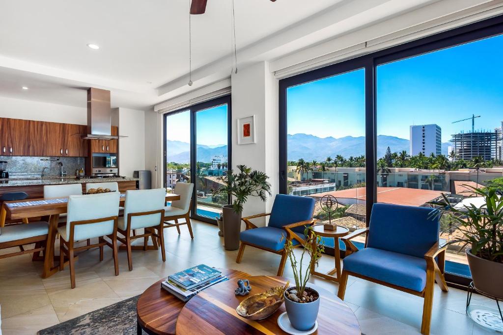 5th-floor condo with partial ocean views, heated pool, sauna, gym, balcony, W/D - 5