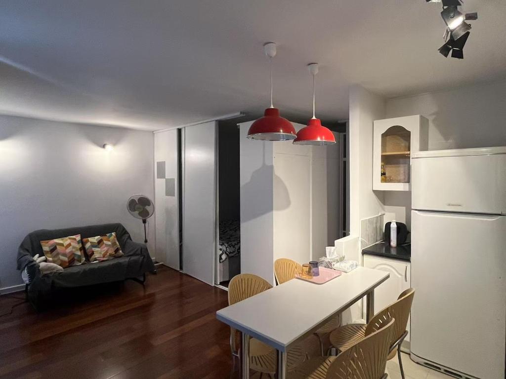 Cozy sunny entire apartment in the 16th arrondissement of Paris with a panoramic view of the Eiffel Tower just 3 minutes from the door Includes kitchen, bathroom, and living room - 4