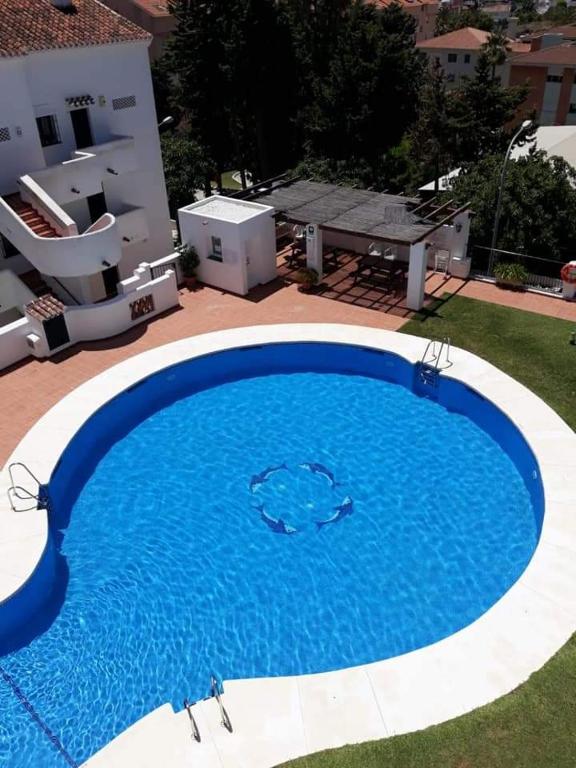 Pool-View Apartment with Terrace & Lift in Pueblo del Parque - 1