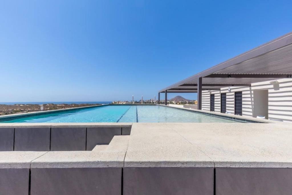 New Condo Right Next to the Beach - Pool - 1