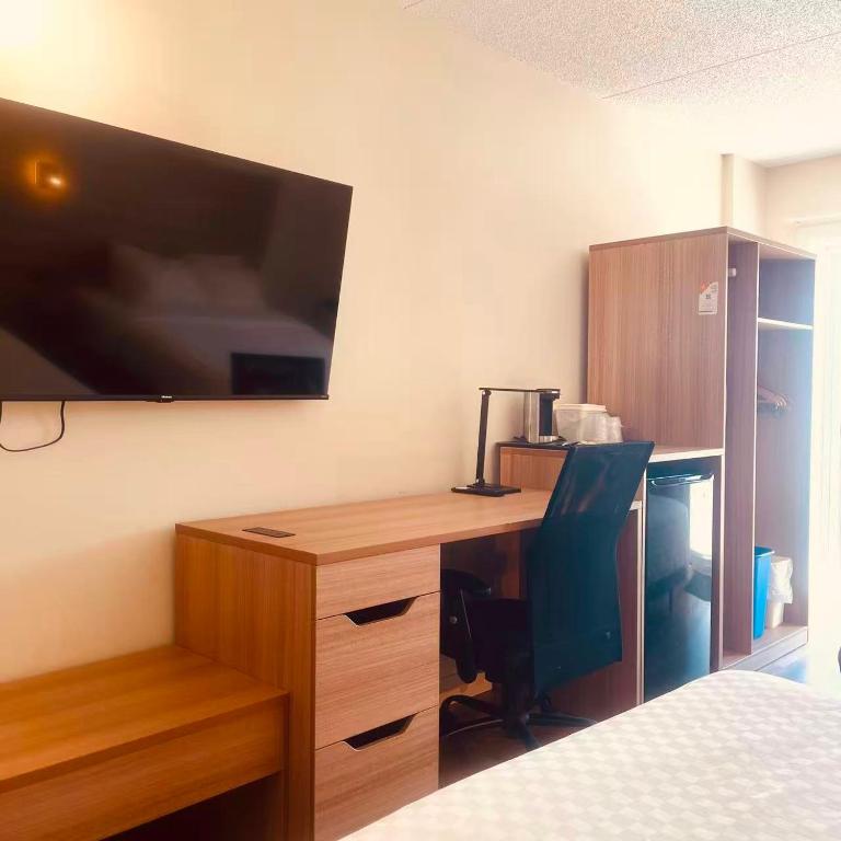 Bilde av King Room på Econo Lodge Airport Quebec