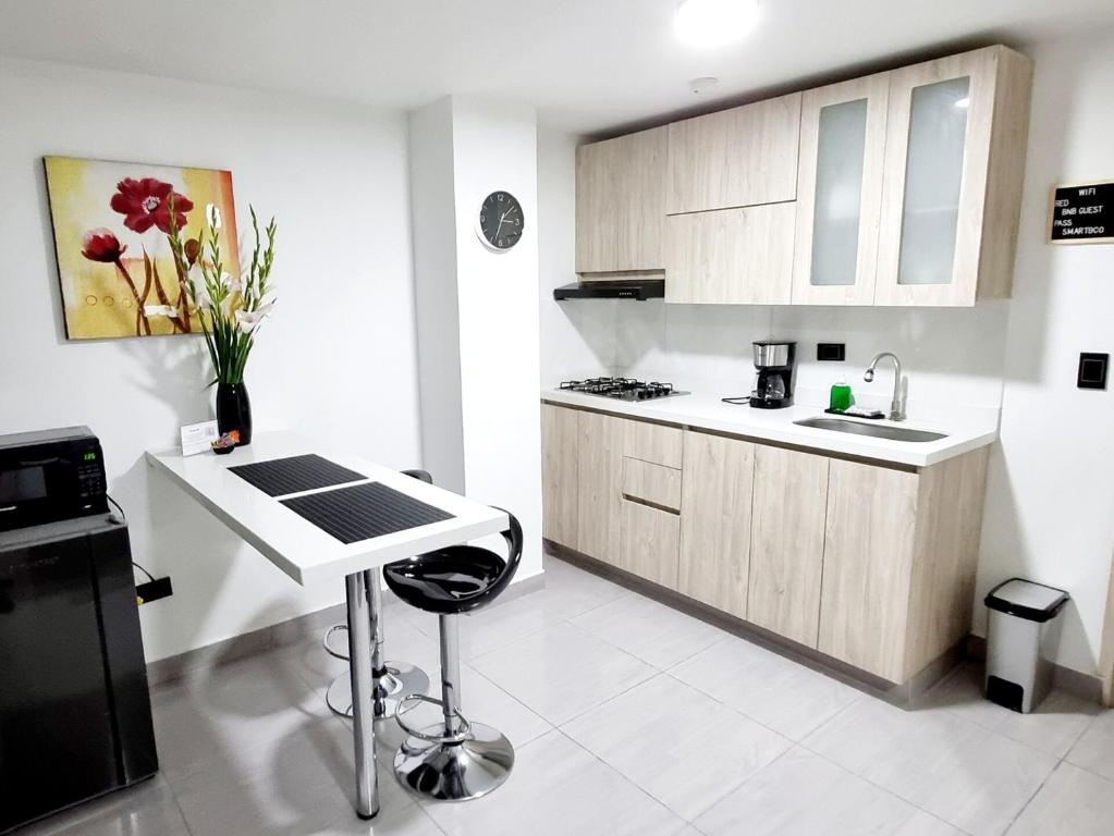 Modern studio, workspace, and full kitchen - 3