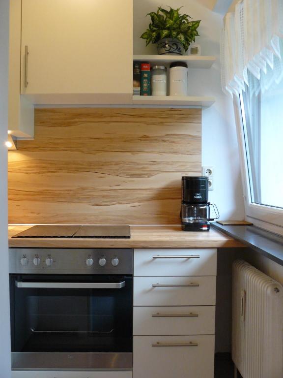Kitchen, Alpenappartements Domicil by Hermann Weiss in Saalbach
