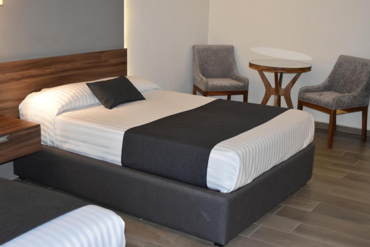 Foto - Estanza Hotel & Suites