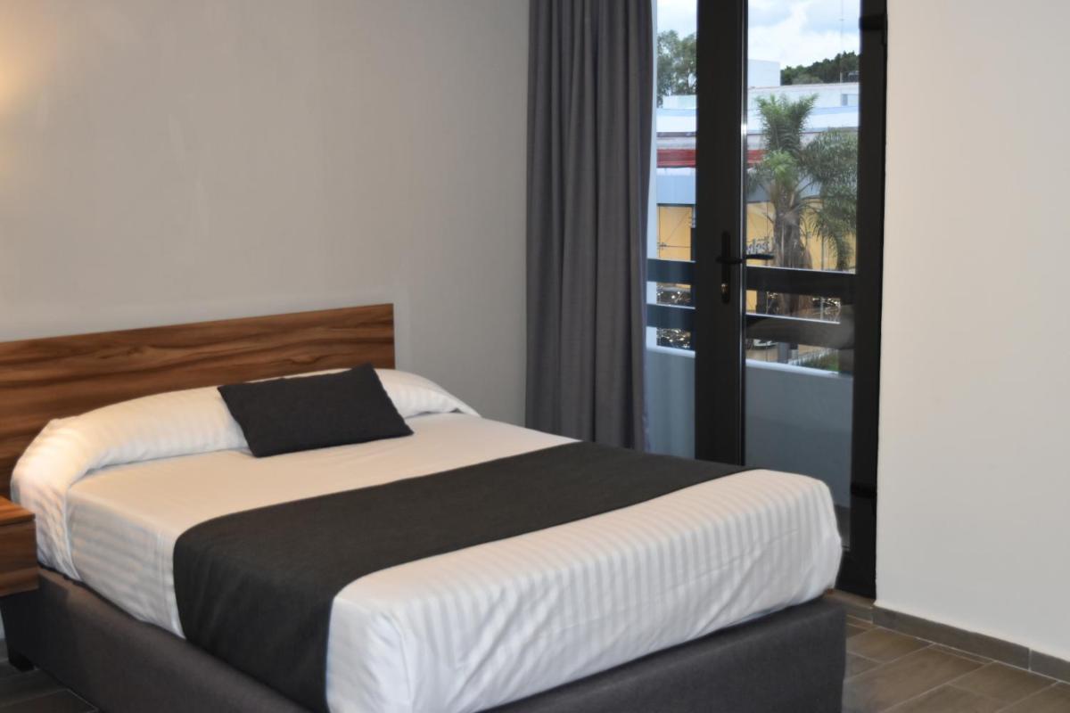 Photo - Estanza Hotel & Suites