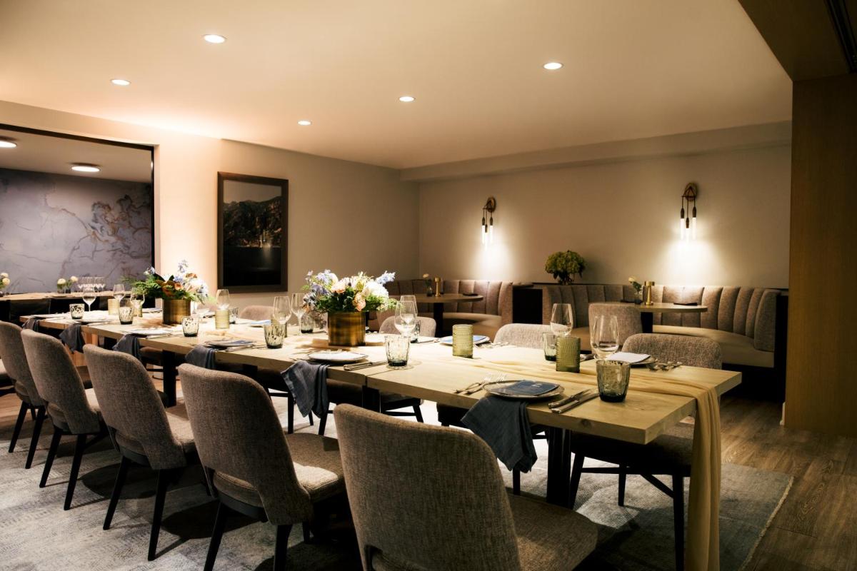 Dining area with tables and banquette seating at The Gwen in Chicago