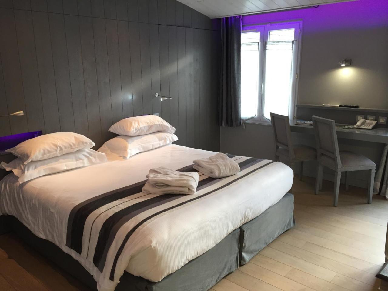 Foto - Elégance Suites Hôtel