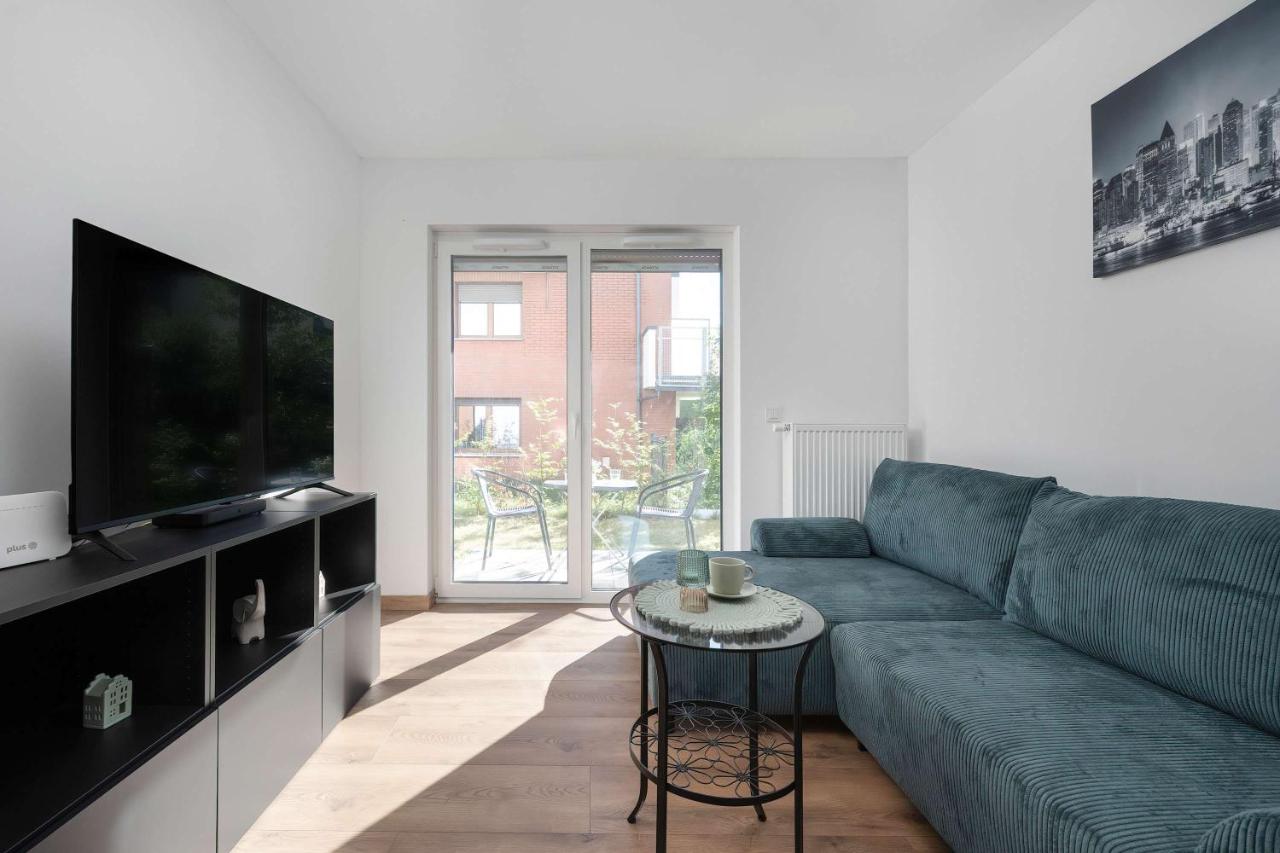 Elegant White Apartment with Terrace & Parking in Wrocław by Noclegi Renters
