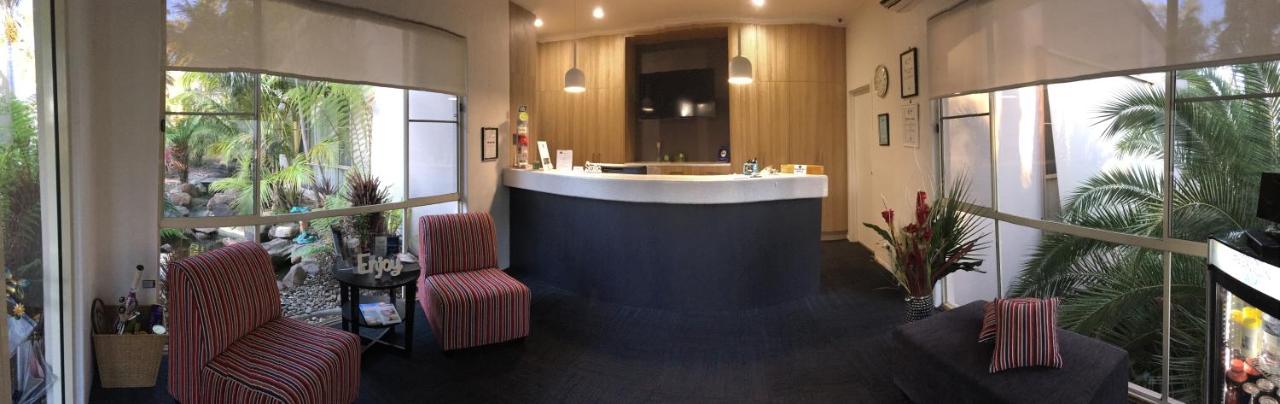 Two red-striped chairs sit at pet-friendly Fairway Motor Inn in Pambula.