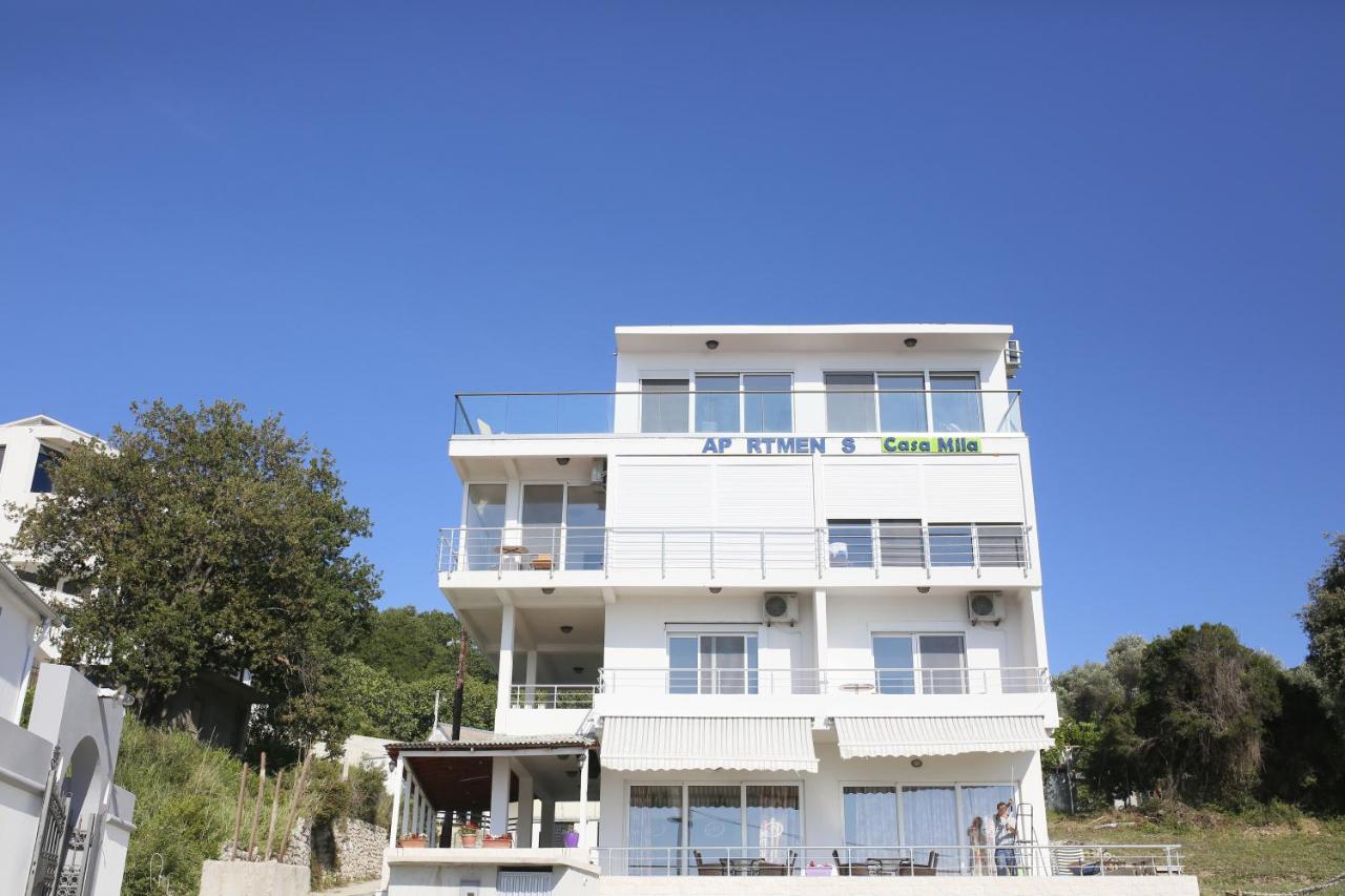White three-story building with balconies stands at pet-friendly Casa Mila Apartments & Bungalows in Ulcinj.