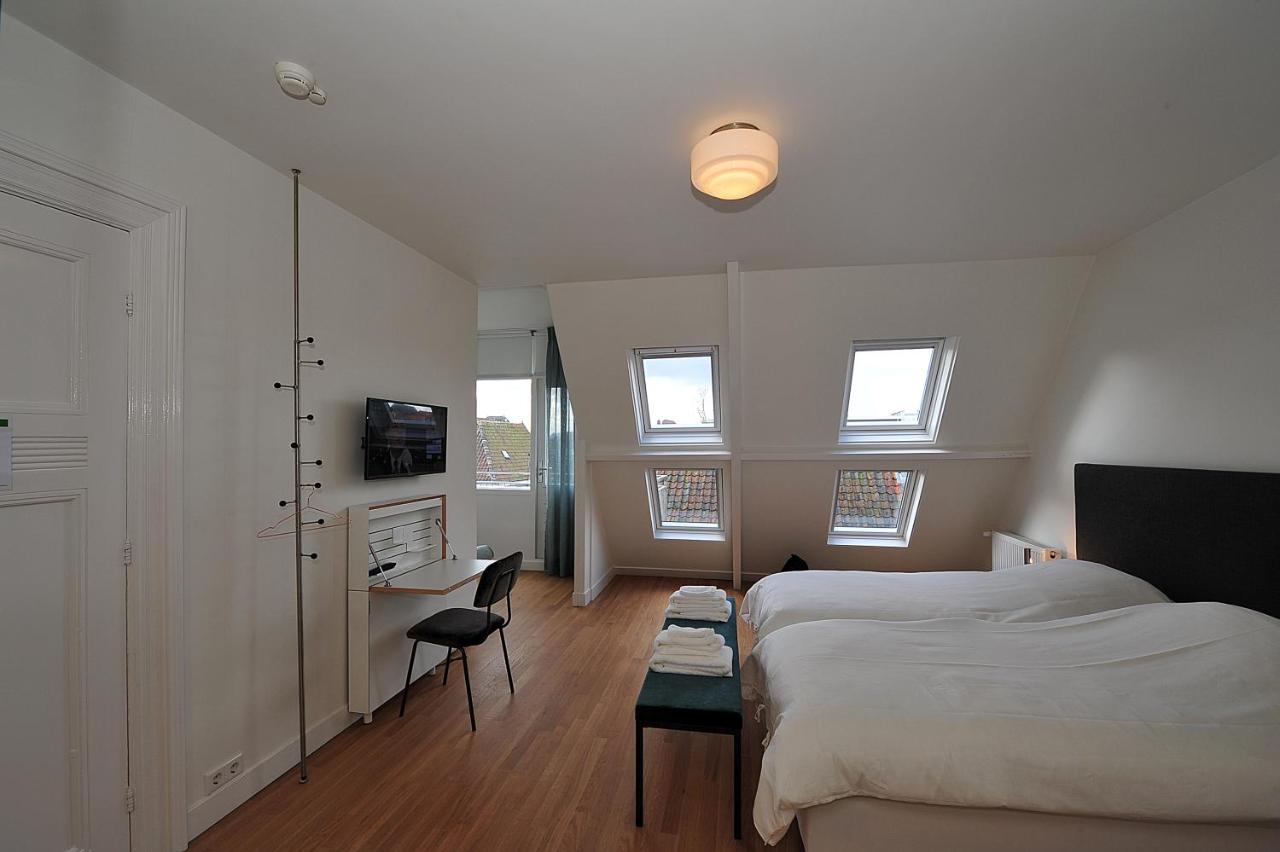 Tweepersoonskamer met 2 aparte bedden en Uitzicht op de Tuin
