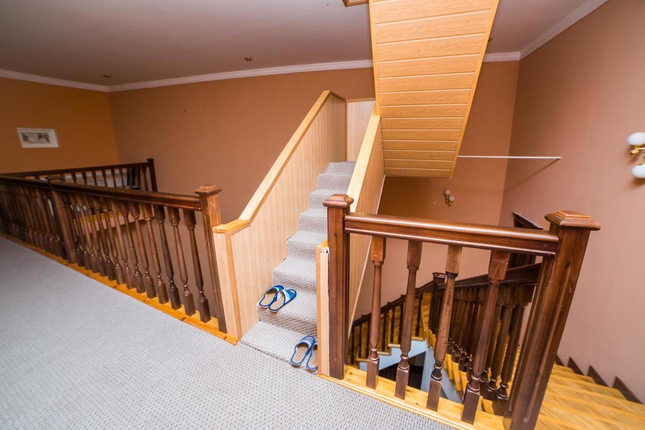 Blue flip-flop slippers rest at dog-friendly GUEST HOUSE Rohat Lux in Samarkand.
