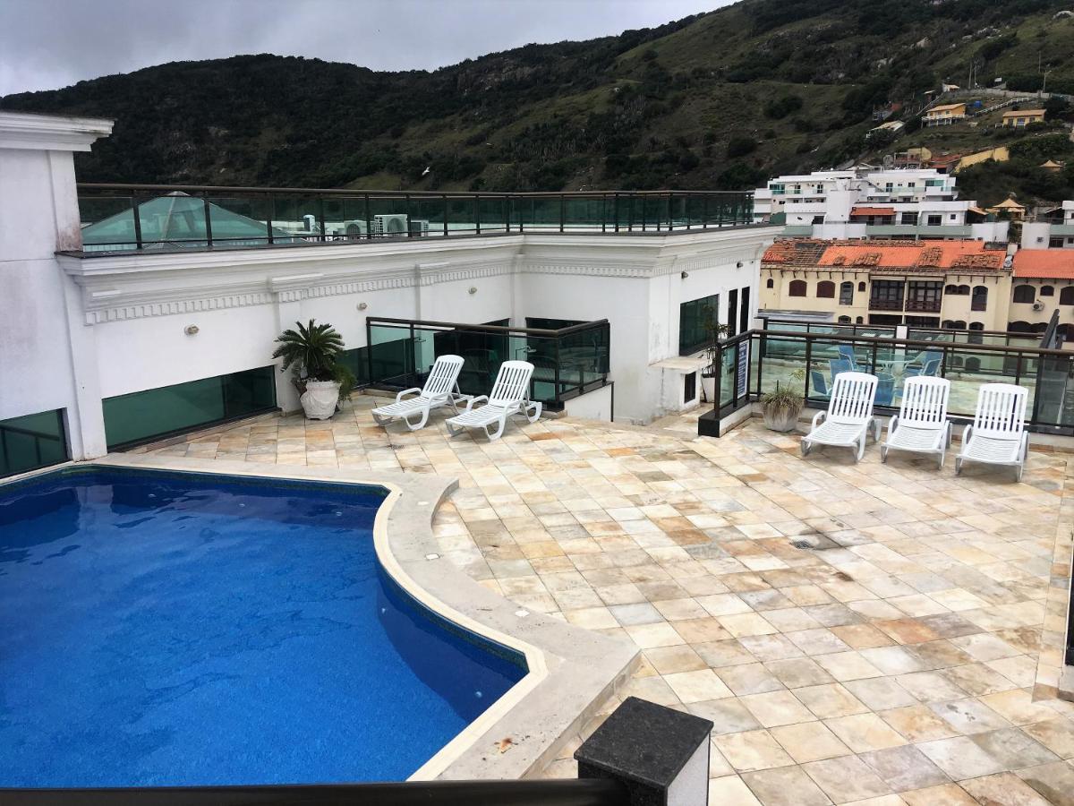 Loft Prainha AP 207 frente mar, Wi-Fi, portaria 24h, check in 9h-check out 13h, split, piscina, self check in - Chambres d'hôtes Arraial do Cabo