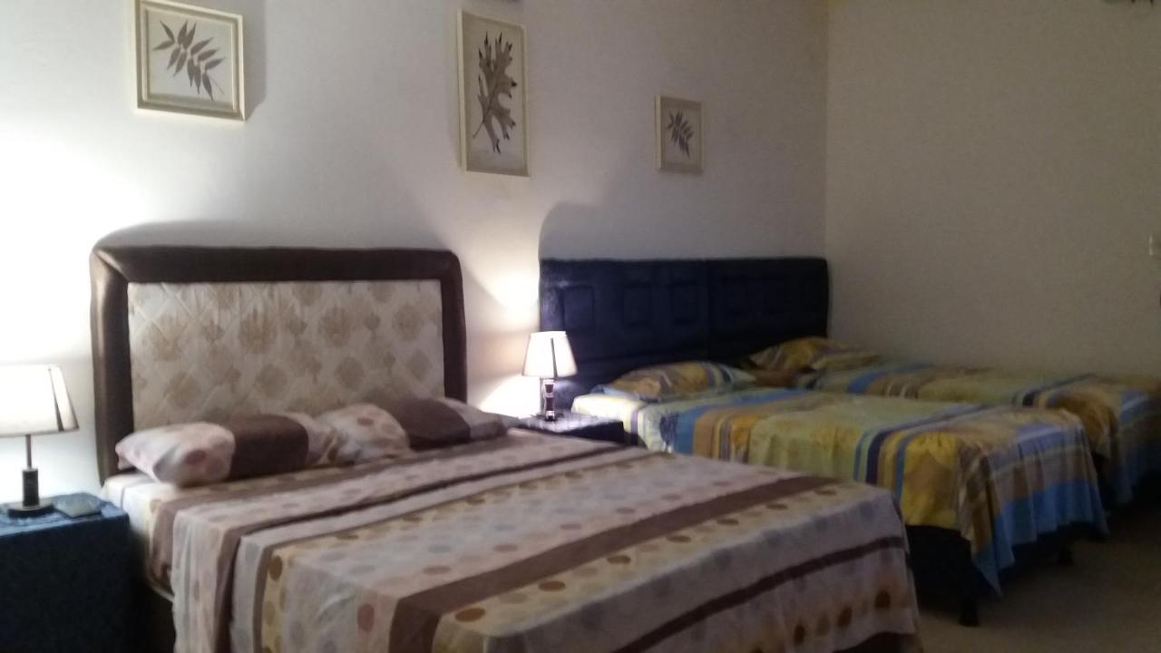 Camera Quadrupla con Vista Giardino 