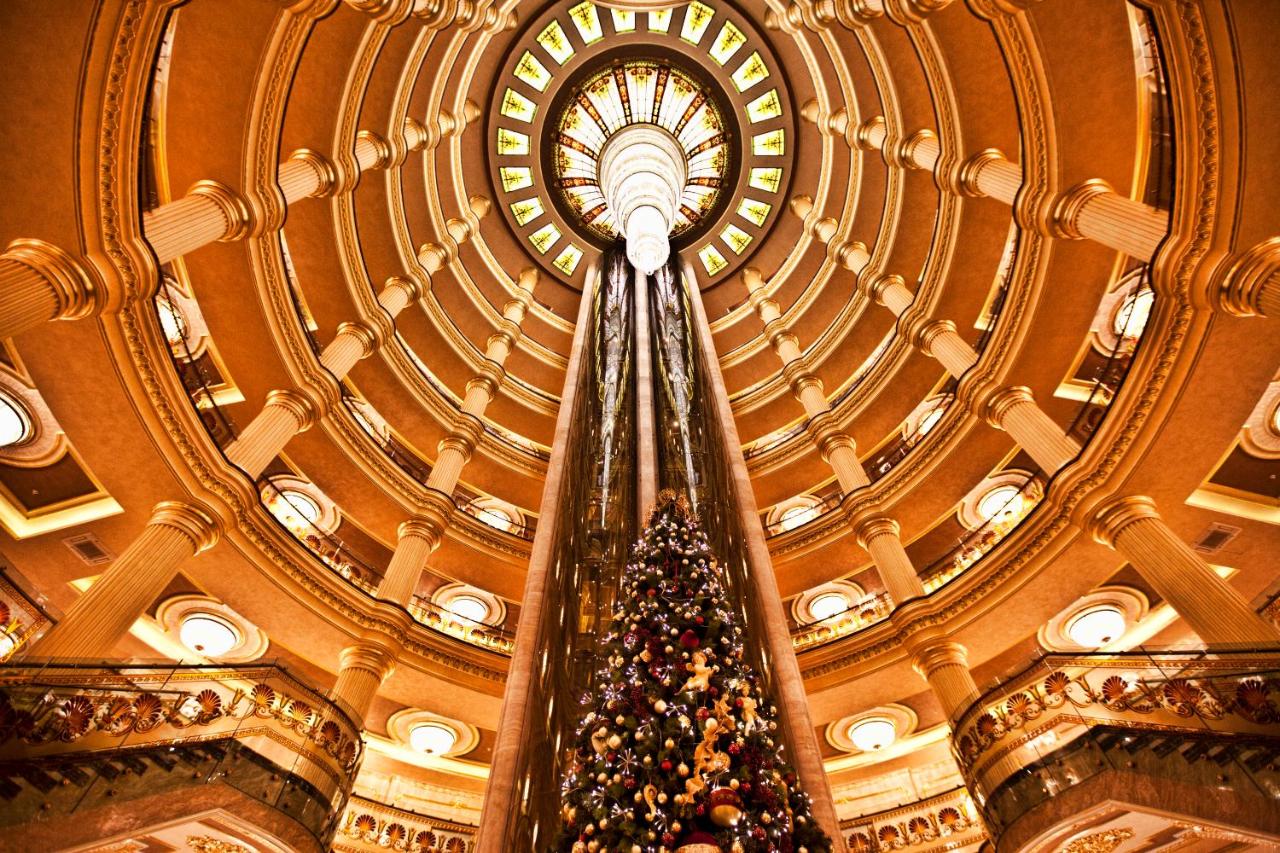 Tall decorated Christmas tree stands at dog-friendly Multi Grand Pharaon Hotel in Agveran.