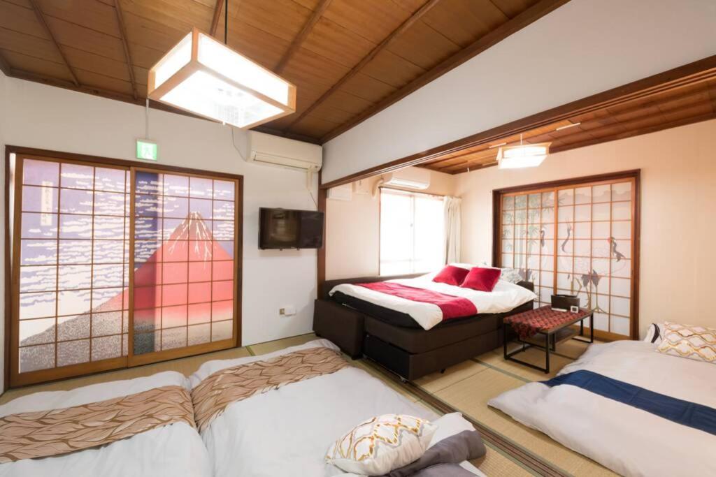 B&B Naha - 90平米一戸建てコンドミニアム最大定員9名様 - Bed and Breakfast Naha