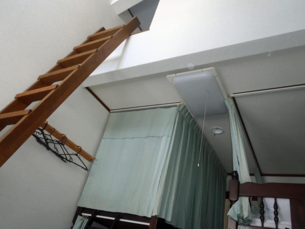 Single Bed in Dormitory Room