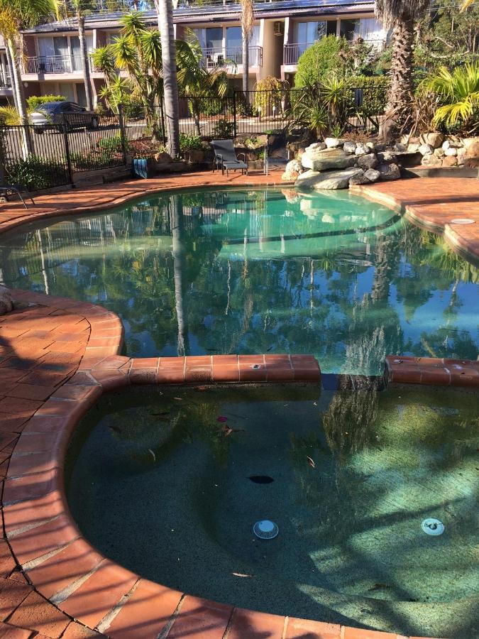 Blue-green pool with terracotta brick edge sits at dog-friendly Fairway Motor Inn in Pambula.