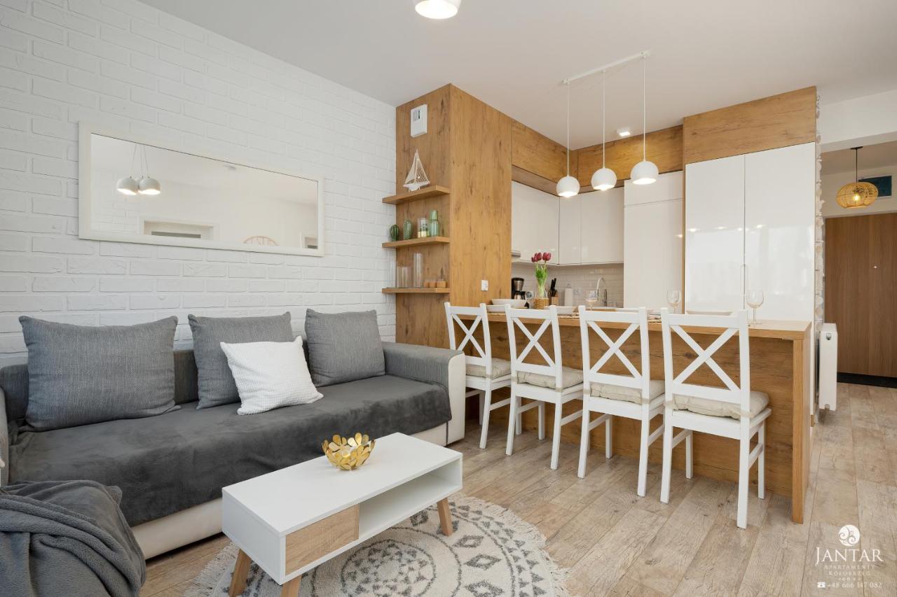 Tolles Familienapartment mit 3 Schlafzimmern einer Terrasse und Garage by Jantar Apartamenty - Chambres d'hôtes Kołobrzeg