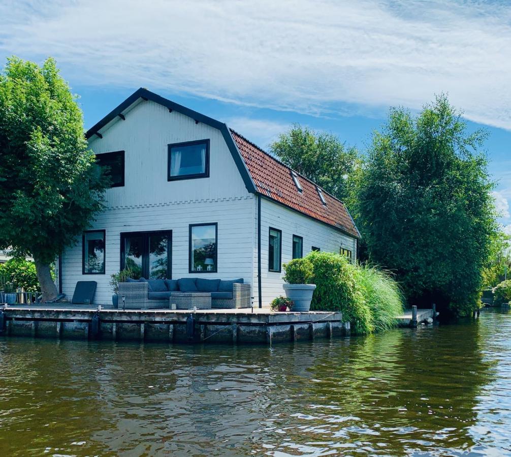 Holiday home at the water, fire place, boat and SUP rent, near Amsterdam - Ferienwohnung Aalsmeer