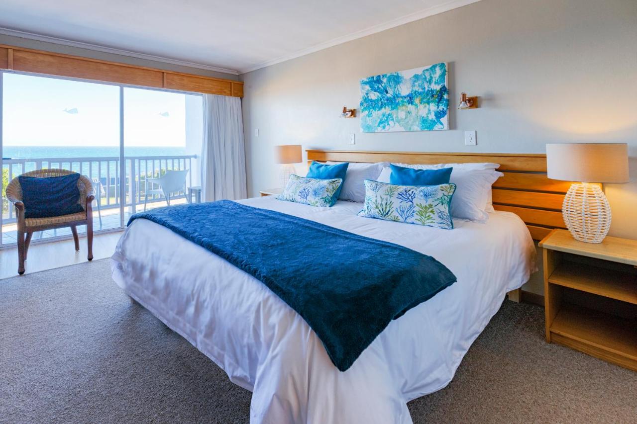 Zweibettzimmer oder Zimmer mit Kingsize-Bett und Meerblick