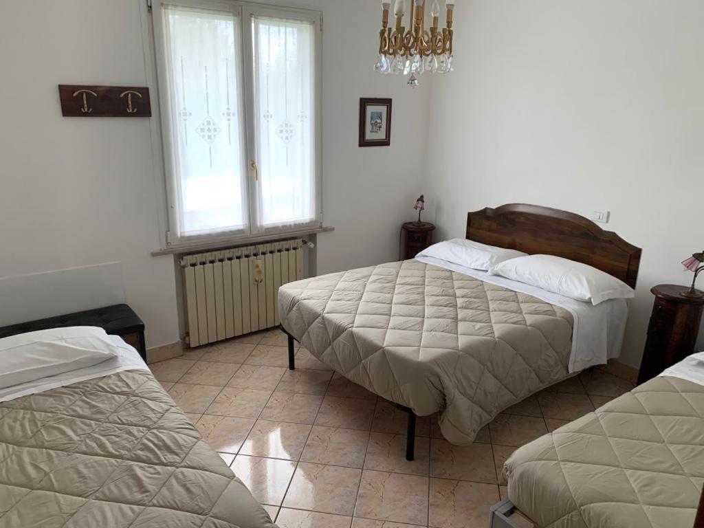 Camera Tripla con Vista Giardino