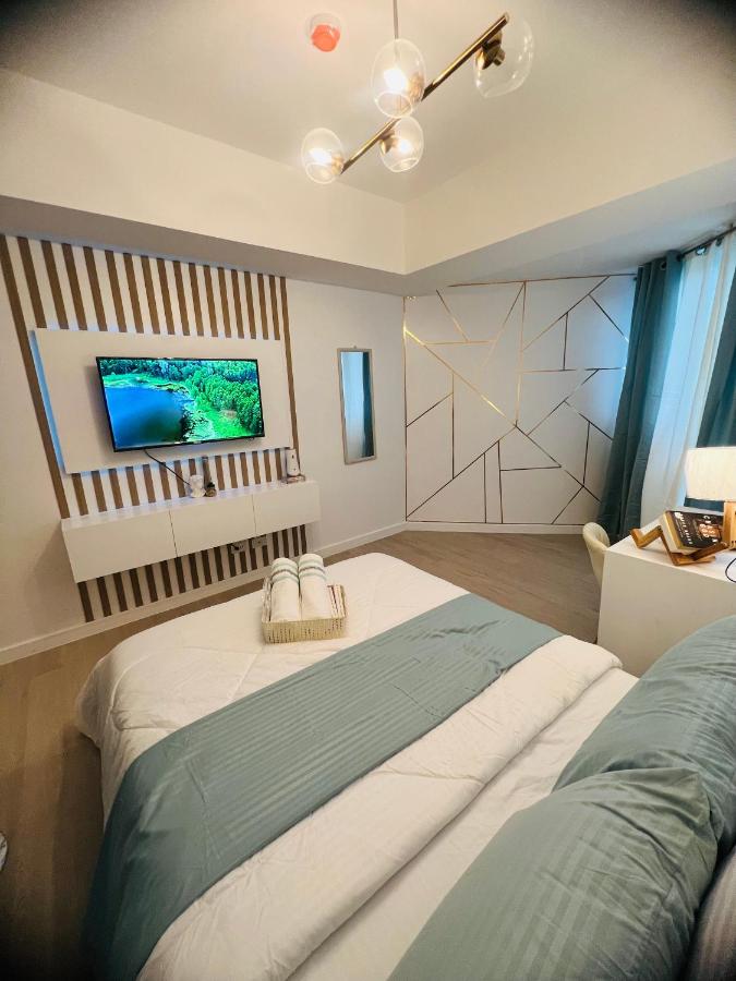 B&B San Fernando City - 2305 Azure North Residence by Cozy Lodgings - Bed and Breakfast San Fernando City