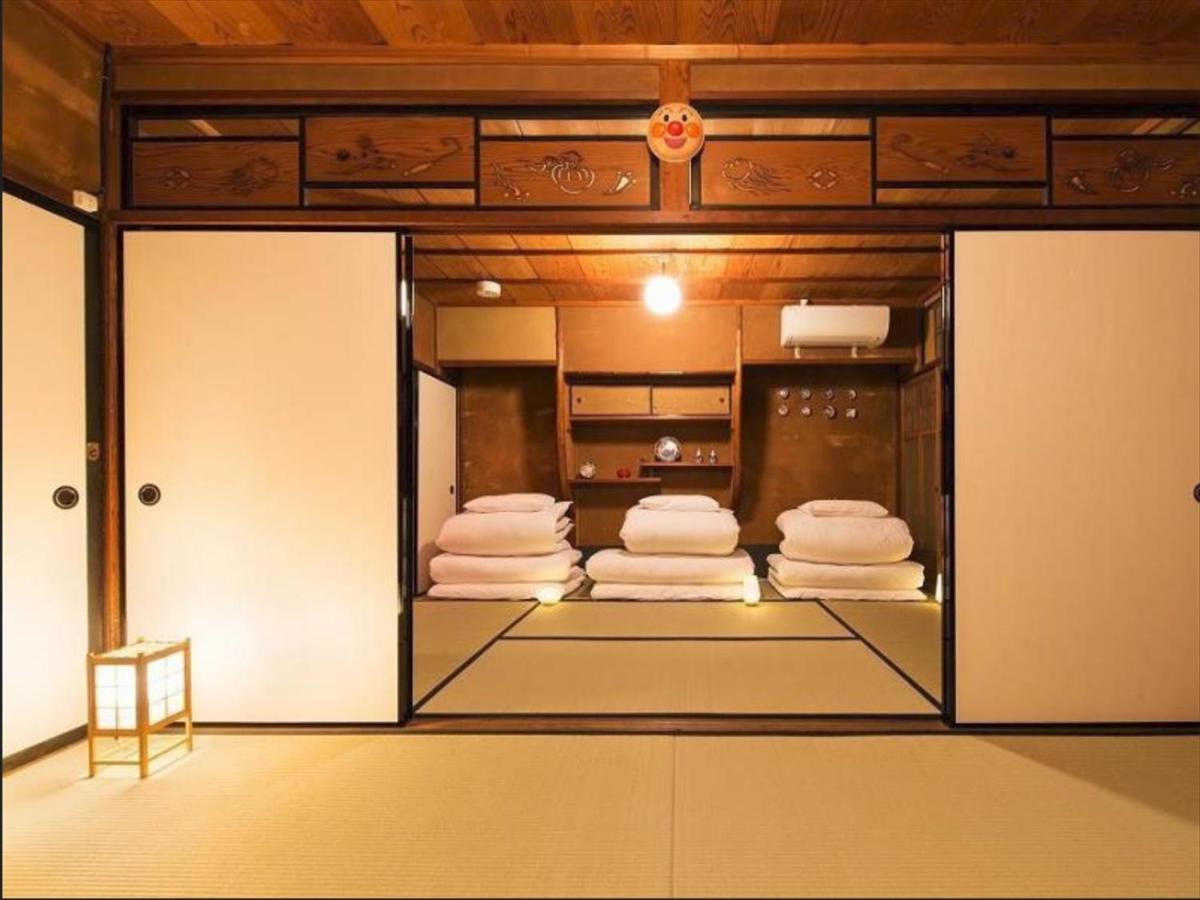 Camera Familiare con Bagno in Comune
