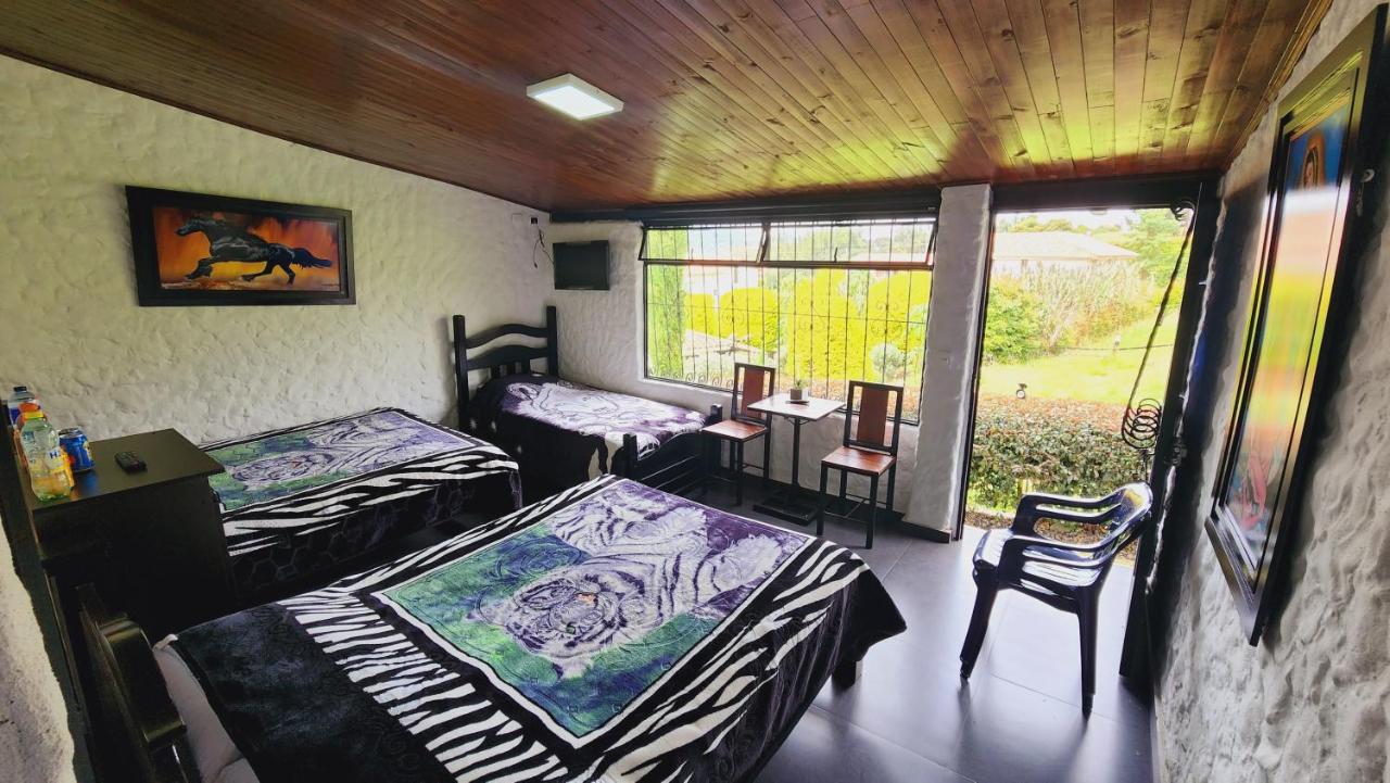 Camera Familiare con Vista Giardino