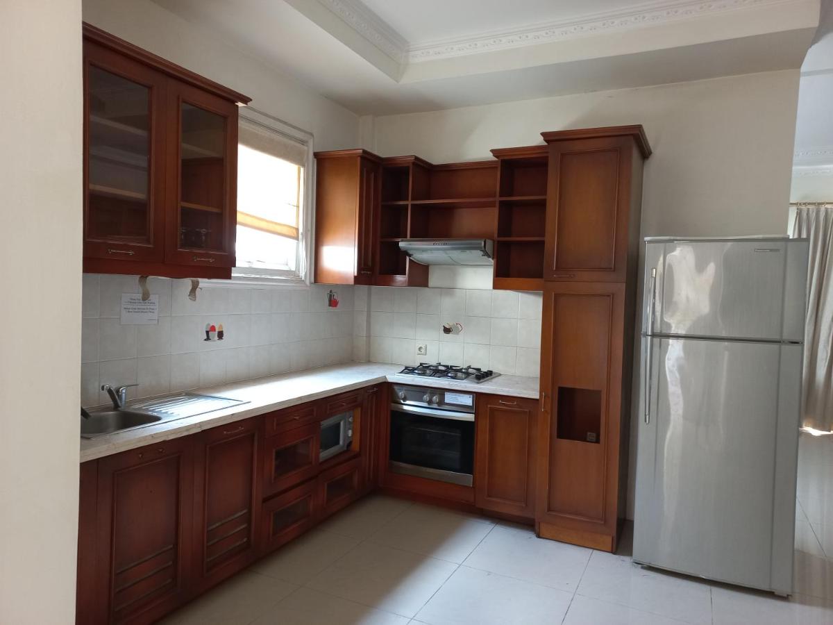 Margot Apartment Pondok Indah - Chambres d’hôtes