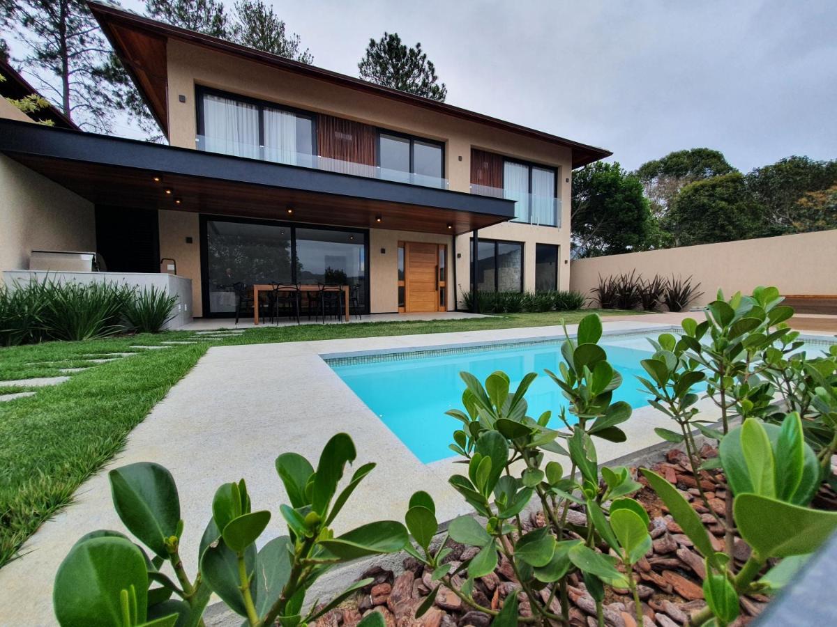 Casa com 4 suítes na Serra C8 - Chambres d’hôtes
