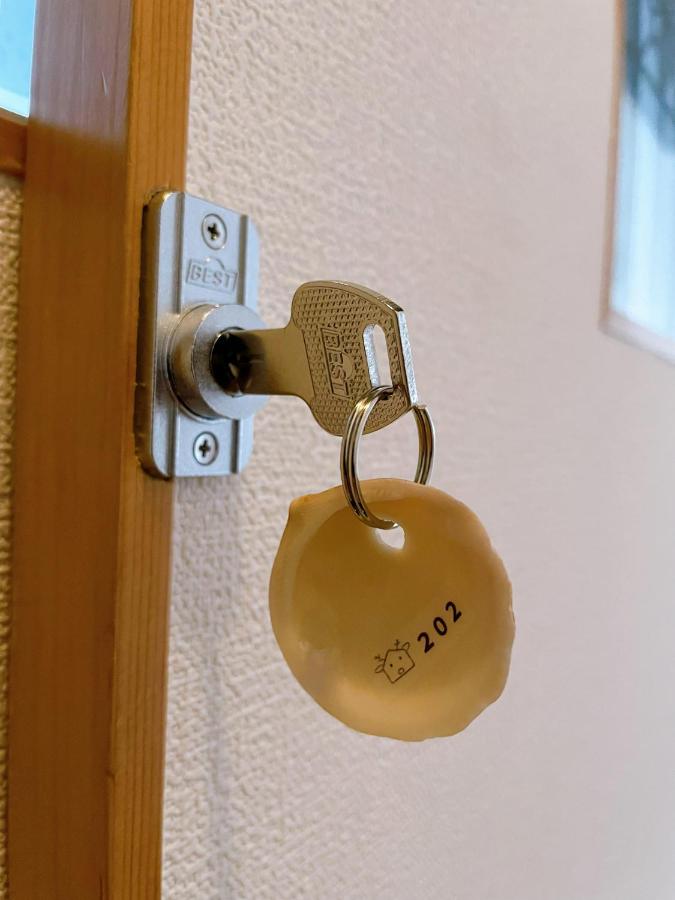 Camera Doppia con Letti Singoli e Bagno in Comune