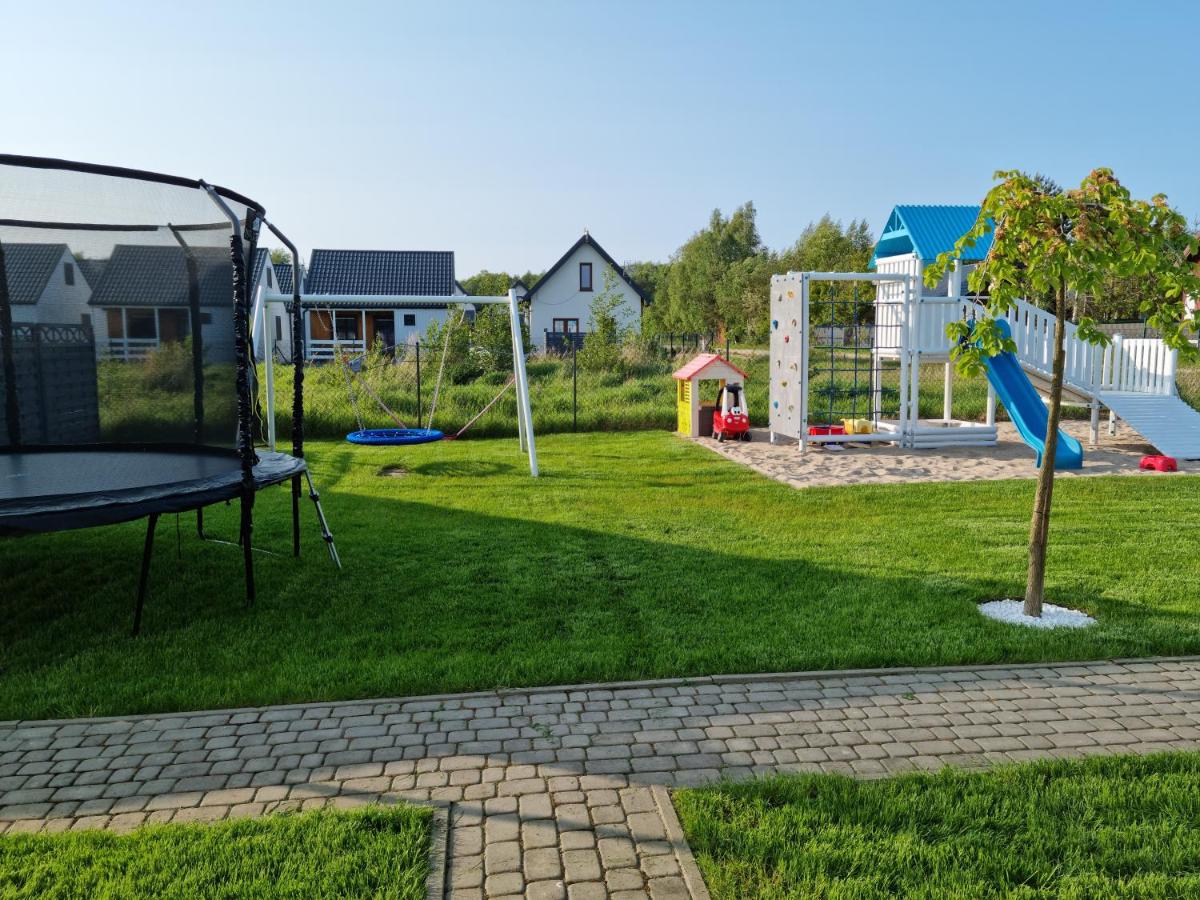 Święty Spokój Rusinowo- domki nad morzem z własnymi ogródkami - Chambres d'hôtes Rusinowo