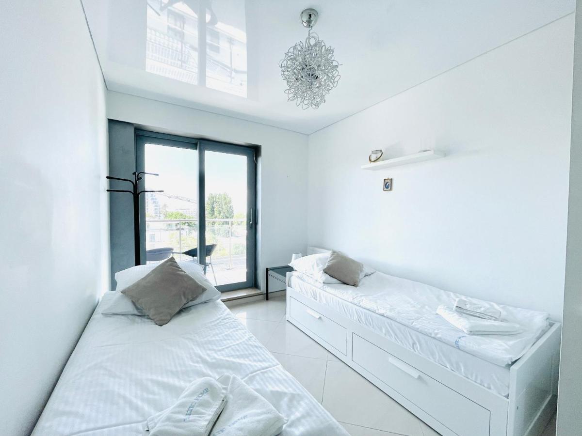 One-Bedroom Apartment with Balcony and Lateral Sea View