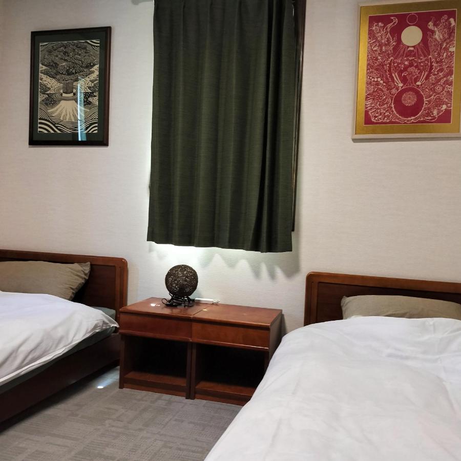 Camera Familiare con Bagno in Comune