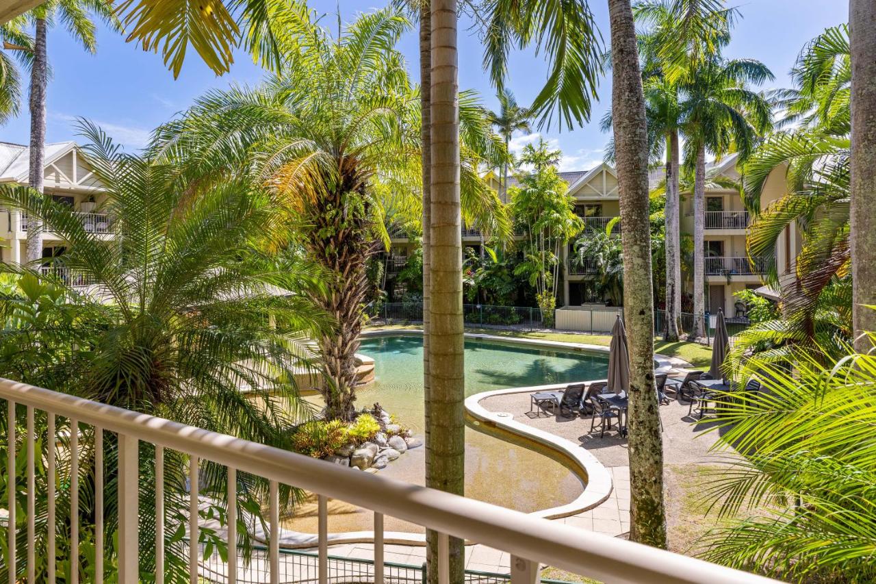 Beige balcony railing frames pool area at pet-friendly Port Douglas Sands Resort in Port Douglas.