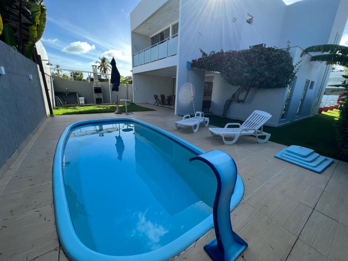 casa de praia com piscina para famílias - B&B Araçã